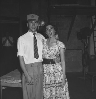 Bemused couple. A young couple pose for the camera, bemused expressions upon their faces, at a