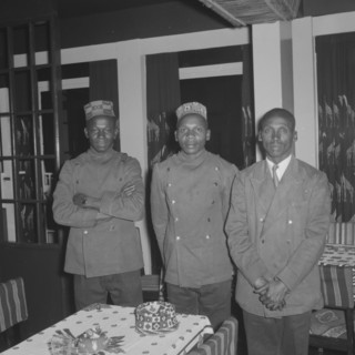 Waiters at the Equator Club. Portrait of three uniformed African waiters at the Equator Club.