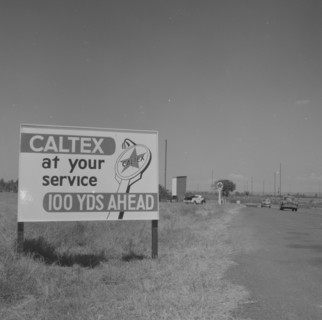 100 yards ahead'. A roadside sign indicates a Caltex Service Service approaching '100 yards ahead'.