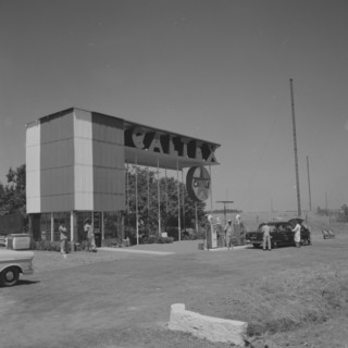 Caltex service station. A car is attended on the forecourt of an ultra-modern Caltex service