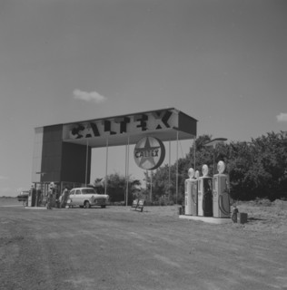 Caltex service station. A car is attended on the forecourt of an ultra-modern Caltex service