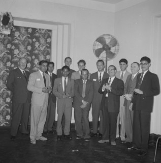 Kodak cocktail party. Mixed race staff employed by Kodak pose for a group portrait at a company