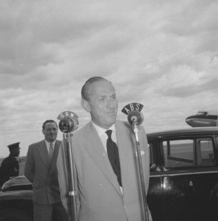 Lennox-Boyd's broadcast. Alan Tindal Lennox-Boyd (1904-1983) broadcasts a speech over microphones
