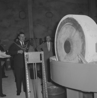 Leyland Paint Factory. A Mayor, dressed in a suit and ceremonial chain, prepares to start machinery