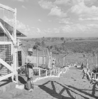 Fort Hall military camp. Armed police guard the steps of a fenced military camp for Kenyan