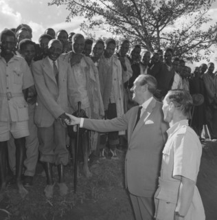 Lennox-Boyd visits Fort Hall. Publicity shot of Alan Tindal Lennox-Boyd (1904-1983) shaking the