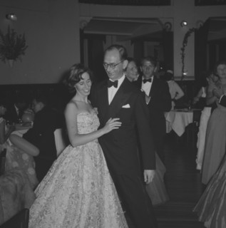 Guests at the Limuru Hunt Ball. A formally dressed couple share a private joke on the dance floor