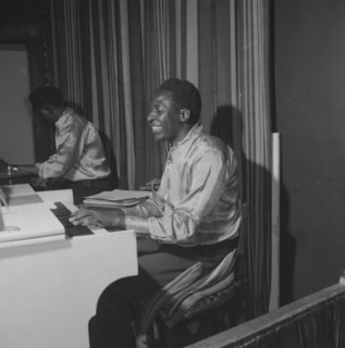 Piano player. An African musician smiles broadly as he plays a piano during a performance at the