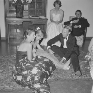 Frivolous behaviour. A young man dressed in a tuxedo teases a girl at the Orme-Smith 21st birthday