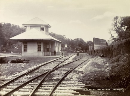 Balaclava railway station. A group of men loiter on the platform and track outside Balaclava