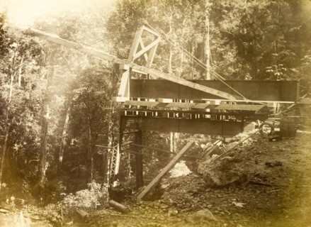 Railway viaduct under construction. Construction equipment in place at the site of a partially