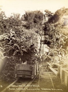 Port Antonio extension line. A roughly-built wooden railway car sits on the tracks at the bottom of