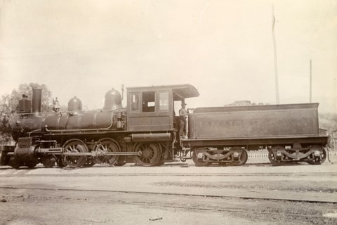 American steam locomotive, Jamaica. An American-manufactured steam locomotive sits on rails at a