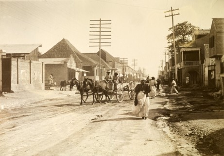 Kingston tram lines. Rails laid down for mule-drawn trams criss-cross a busy road crowded with