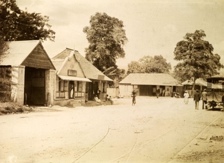 Jamaica Street Car Company. Rails laid down for mule-drawn trams criss-cross a wide, empty road