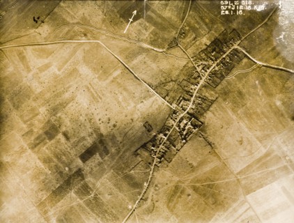 Aerial view of a bomb-damaged village. One of a series of British aerial reconnaissance photographs