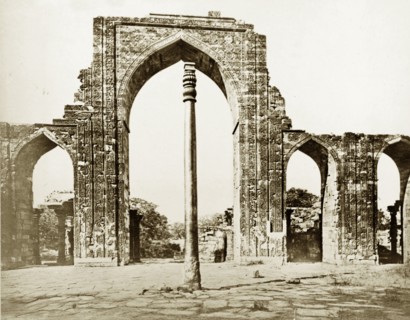 The Iron Pillar at Qutb, circa 1865. The Iron Pillar stands before the ruins of Quwwat-ul-Islam