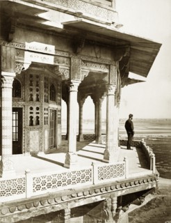 View from the Samman Burj. A lone figure takes in the view from a balcony on the Samman Burj, an
