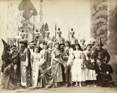 Cast of Lalla Rookh. The European cast in a pantomime of Lalla Rookh. The group stand on stage in