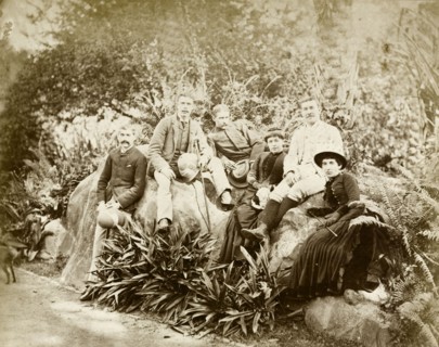 Relaxing in Eden Gardens. Informal group portrait of four European men and two women relaxing in