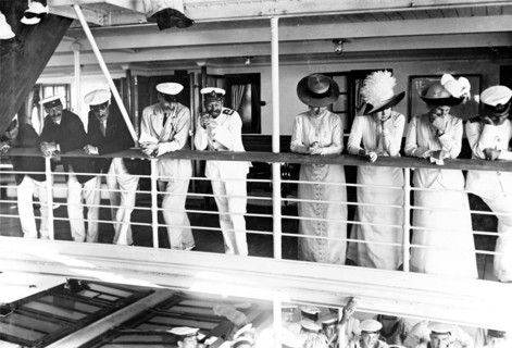 On board entertainment. King George V (r.1910-36), Queen Mary and her Ladies in Waiting are