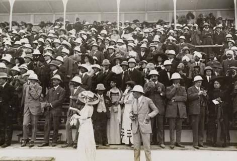 Spectators at a steeplechase. European, Indian and Eurasian spectators watch a steeplechase from