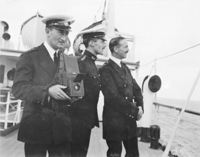 Photography from the S.S. Balmoral Castle. Two British naval officers admire the view from the deck