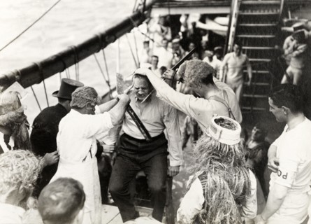 Antics aboard the S.S. Balmoral Castle. Crew members aboard the S.S. Balmoral Castle clown about on