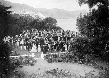 Garden party for the Duke of Connaught. Formally dressed guests socialise at a garden party held in