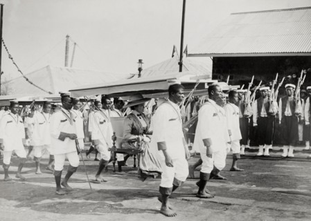 Duchess of Connaught in a portable chair. The Duchess of Connaught is carried along in a portable