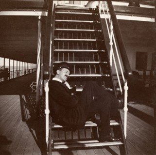 Seating arrangements on the S.S. Balmoral Castle. A passenger aboard the S.S. Balmoral Castle sits