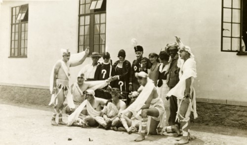 Soldiers in fancy dress. A group of British soldiers pose, wearing a variety of fancy dress