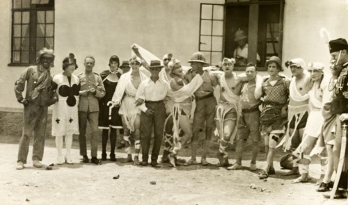 Soldiers in fancy dress. A group of British soldiers pose, wearing a variety of fancy dress