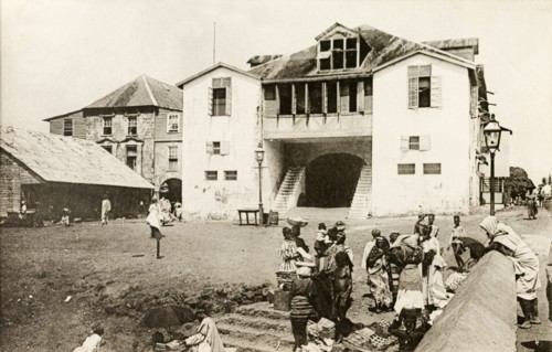 Freetown police station. Women sell textiles outside Freetown police station and law courts.