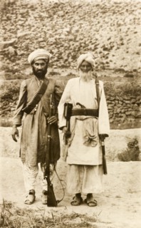 Armed Afridi men. Portrait of two Afridi men at the north west frontier, both armed with rifles and