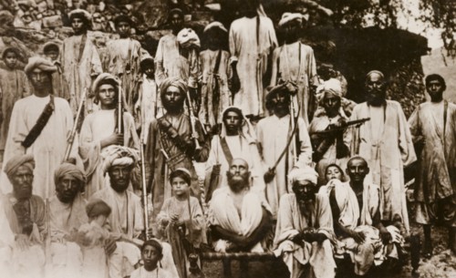 Islamic Mullah with followers. Group portrait of an Islamic Mullah with his religious followers,