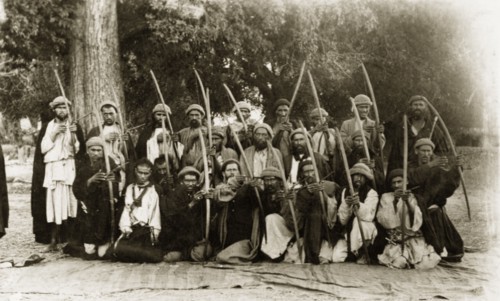 Kafir archers, Pakistan. A group of Kafir archers pose for the camera, their arrows pulled back as