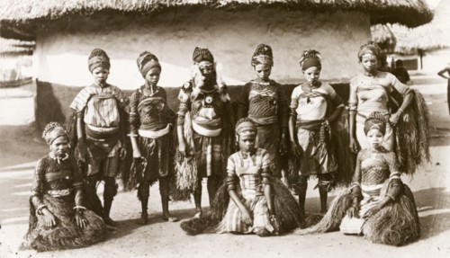 Sierra Leone dancers. Nine young women dressed in traditional dance costume pose for the camera