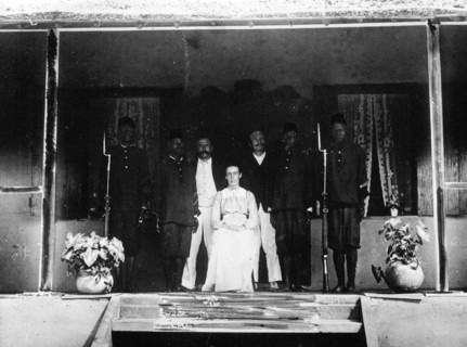 Congo Balolo Mission. Group portrait of European members of the Congo Balolo Mission under guard,