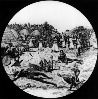 Slave raid in an African village. African warriors attempt to defend their village from a raid by