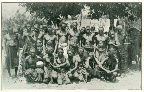 Congolese rubber slaves. Portrait of a group of male slaves, tied together with ropes around their