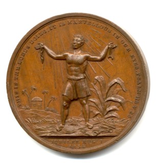 Slavery Abolition Act coin. Close-up of a coin commemorating the United Kingdom's Slavery Aboliton