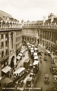 The Quadrant, London. A row of double-decker buses line The Quadrant at the bottom of Regent Street