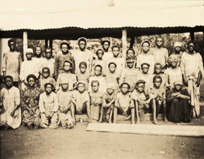 Inhabitants of Bioko. A group of men, women and children from Bioko line up for the camera. Bioko,