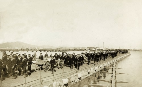 Naval troops at Gibraltar. British naval troops march along a quayside. One of several photographs
