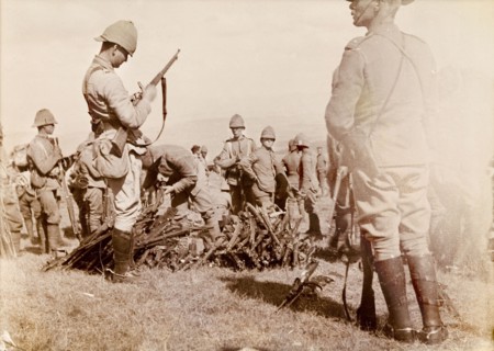 Rifles relinquished at Slaapkrans. British forces examine and dismantle a haul of Boer rifles,