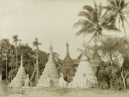Stone 'zeidis' at Wuntho. Several carved stone 'zeidis' or pagodas are guarded by stone 'chinthes'