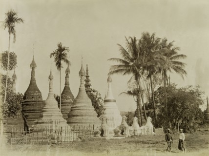 Stone 'zeidis' at Wuntho. Several carved stone 'zeidis' or pagodas are guarded by stone 'chinthes'