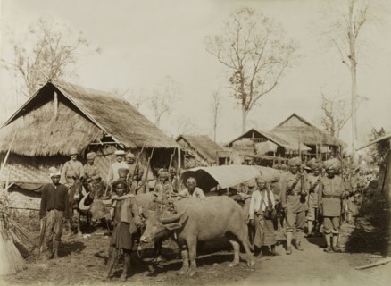 Village at the Morgandine Pass. Armed British and Indian soldiers pose beside a bullock-drawn cart
