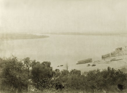 View of the Ayeyarwady River. View across the Ayeyarwady River showing several ferry boats moored